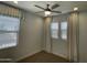 Bright bedroom featuring window with blinds and white curtains at 1840 S Follett Way, Gilbert, AZ 85295