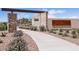 Community entrance signage with stone and masonry architecture, complemented by desert landscaping and a paved path at 1840 S Follett Way, Gilbert, AZ 85295