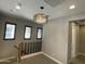 Upstairs hallway with decorative chandelier at 1840 S Follett Way, Gilbert, AZ 85295