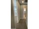 Hallway leading to bedrooms and a bathroom at 1840 S Follett Way, Gilbert, AZ 85295