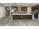 Spacious kitchen with a large island, stainless steel appliances, and modern pendant lighting at 1840 S Follett Way, Gilbert, AZ 85295