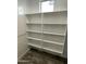 Well-organized pantry with white shelving and wood-look flooring at 1840 S Follett Way, Gilbert, AZ 85295