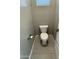 Small powder room with neutral tones and tile flooring at 1840 S Follett Way, Gilbert, AZ 85295