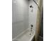 Bathroom features a shower with white subway tile walls and a shower curtain with a patterned design at 1840 S Follett Way, Gilbert, AZ 85295