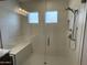 Modern shower with glass door, bench, and stylish fixtures at 1840 S Follett Way, Gilbert, AZ 85295