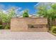 Landscaped backyard with a stone feature and paved patio, perfect for outdoor entertaining at 1848 S Follett Way, Gilbert, AZ 85295