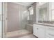 Modern bathroom boasts a glass-enclosed shower, vanity, and elegant tile accents at 1848 S Follett Way, Gilbert, AZ 85295