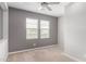 Bedroom featuring carpet floors and ample natural light from windows at 1848 S Follett Way, Gilbert, AZ 85295