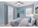 Calming bedroom with blue accents, soft lighting, and a private balcony view at 1848 S Follett Way, Gilbert, AZ 85295