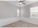 Cozy bedroom features carpet floors, a ceiling fan, and classic wainscoting detail at 1848 S Follett Way, Gilbert, AZ 85295