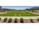 Lush community park with manicured lawn and walking paths surrounded by well-maintained landscaping and neighborhood homes at 1848 S Follett Way, Gilbert, AZ 85295