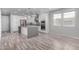 Open-concept kitchen with island, stainless appliances, pendant lights, and modern finishes at 1848 S Follett Way, Gilbert, AZ 85295