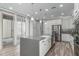 Bright kitchen featuring a large center island, stainless steel appliances, and ample cabinet space at 1848 S Follett Way, Gilbert, AZ 85295