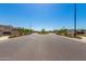 Inviting neighborhood entrance with decorative signage, manicured landscaping, and street lighting for a welcoming atmosphere at 1848 S Follett Way, Gilbert, AZ 85295