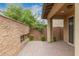 Covered patio featuring a stone accent wall with room for outdoor enjoyment at 1848 S Follett Way, Gilbert, AZ 85295