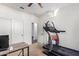 Bedroom featuring a treadmill and closet with ample room for activities at 18581 W College Dr, Goodyear, AZ 85395