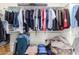 Walk-in closet with clothing racks, shelving, and ample storage space at 18581 W College Dr, Goodyear, AZ 85395