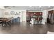 Open-concept kitchen featuring stainless steel appliances and a breakfast bar at 18581 W College Dr, Goodyear, AZ 85395