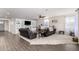 Cozy living room featuring comfortable seating and a built-in entertainment center at 18581 W College Dr, Goodyear, AZ 85395