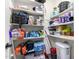 Walk-in pantry with lots of shelving space for dry goods and household supplies at 18581 W College Dr, Goodyear, AZ 85395