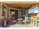 Outdoor patio featuring comfortable seating, a barbecue area, and a ceiling fan at 18581 W College Dr, Goodyear, AZ 85395
