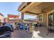 Outdoor patio with a built-in bar and barbecue area, perfect for entertaining at 18581 W College Dr, Goodyear, AZ 85395