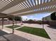 Beautiful backyard with artificial grass, brick pavers and shaded pergola at 18629 W Fulton St, Goodyear, AZ 85338
