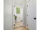 Passage to a bright, neutral-toned powder room at 19160 E Canary Way, Queen Creek, AZ 85142