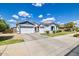 Spacious home with a three-car garage, manicured lawn, and desert landscaping in a desirable neighborhood at 19160 E Canary Way, Queen Creek, AZ 85142