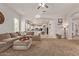 Bright living room flows into an open kitchen with stainless appliances, offering a welcoming space at 19160 E Canary Way, Queen Creek, AZ 85142