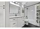 Modern bathroom featuring sleek fixtures, a white vanity, and contemporary black and white tile at 20100 N 78Th Pl # 1023, Scottsdale, AZ 85255