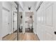 Hallway between closets with access to two stylish powder rooms at 20100 N 78Th Pl # 1023, Scottsdale, AZ 85255