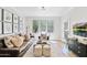 Comfortable living room with a leather couch, accent seating, and stylish decor at 20100 N 78Th Pl # 1023, Scottsdale, AZ 85255