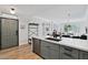 Open-concept living space with updated gray cabinetry and access to the front door at 20100 N 78Th Pl # 1023, Scottsdale, AZ 85255