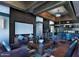 Cozy lounge area with comfortable seating, large screen, and stylish decor at 20100 N 78Th Pl # 1023, Scottsdale, AZ 85255