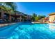 Beautiful community pool surrounded by inviting lounge chairs and lush landscaping, perfect for outdoor relaxation at 20100 N 78Th Pl # 1023, Scottsdale, AZ 85255