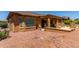 Backyard with a rock garden and covered patio at 20283 N 273Rd Ave, Buckeye, AZ 85396