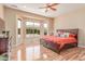 Bright main bedroom boasts hardwood floors, large windows, and great natural light at 20283 N 273Rd Ave, Buckeye, AZ 85396