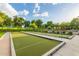 Bocce ball court featuring two courts with blue shade structures and benches amongst a park-like environment at 20283 N 273Rd Ave, Buckeye, AZ 85396