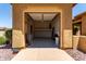 Attached two-car garage with finished walls and interior lighting at 20283 N 273Rd Ave, Buckeye, AZ 85396