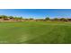Wide golf course view highlighting the well-maintained green and scenic surroundings, emphasizing the community's landscape at 20283 N 273Rd Ave, Buckeye, AZ 85396