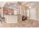Inviting kitchen boasts stainless appliances, granite counters, and breakfast bar at 20283 N 273Rd Ave, Buckeye, AZ 85396
