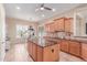 Well appointed kitchen features granite countertops, a kitchen island, and tile floors at 20283 N 273Rd Ave, Buckeye, AZ 85396