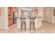 Kitchen with stainless appliances, breakfast bar, and stylish decor at 20283 N 273Rd Ave, Buckeye, AZ 85396