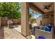 Inviting back patio with outdoor seating, brick pavers, and manicured landscaping at 2048 S Martingale Rd, Gilbert, AZ 85295
