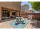 Beautiful backyard patio with outdoor seating and a grill, perfect for entertaining at 2048 S Martingale Rd, Gilbert, AZ 85295