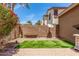 Lush backyard with well-maintained artificial grass and a seating bench at 2048 S Martingale Rd, Gilbert, AZ 85295