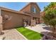 Backyard with low maintenance artificial grass and convenient storage area at 2048 S Martingale Rd, Gilbert, AZ 85295