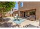 Spacious backyard patio with comfortable seating, ideal for relaxing or entertaining guests at 2048 S Martingale Rd, Gilbert, AZ 85295