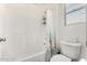 Clean white bathroom featuring shower-tub combo, and white fixtures at 2048 S Martingale Rd, Gilbert, AZ 85295